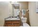 Clean bathroom with wood cabinets, granite countertop, and a toilet at 2212 Valterra Vista Way, Valrico, FL 33594