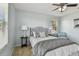 Bedroom with queen bed, gray bedding, and blue chair at 2212 Valterra Vista Way, Valrico, FL 33594