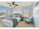 Bright bedroom with a queen-size bed and sitting chair at 2212 Valterra Vista Way, Valrico, FL 33594