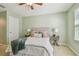 Charming bedroom with neutral decor and ceiling fan at 2212 Valterra Vista Way, Valrico, FL 33594