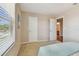 Well-lit bedroom with a large window and neutral walls at 2212 Valterra Vista Way, Valrico, FL 33594