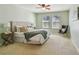 Bright bedroom with plush bed, ample natural light, and ceiling fan at 2212 Valterra Vista Way, Valrico, FL 33594