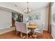 Bright dining room featuring hardwood floors and a chandelier at 2212 Valterra Vista Way, Valrico, FL 33594