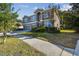 Two-story house with three-car garage and manicured lawn at 2212 Valterra Vista Way, Valrico, FL 33594