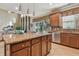 Kitchen boasts large island with seating, granite countertops, and stainless steel appliances at 2212 Valterra Vista Way, Valrico, FL 33594