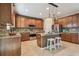 Spacious kitchen with island, stainless steel appliances, and granite countertops at 2212 Valterra Vista Way, Valrico, FL 33594