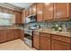 Kitchen features stainless steel appliances and granite countertops at 2212 Valterra Vista Way, Valrico, FL 33594