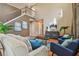 Spacious living room featuring high ceilings, hardwood floors, and ample natural light at 2212 Valterra Vista Way, Valrico, FL 33594