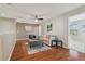 Bright loft with hardwood floors, couch and ottoman at 2212 Valterra Vista Way, Valrico, FL 33594