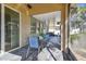 Spacious screened porch with slate tile flooring and outdoor furniture at 2212 Valterra Vista Way, Valrico, FL 33594