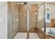 Large walk-in shower with glass enclosure and tile surround at 2212 Valterra Vista Way, Valrico, FL 33594