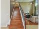 Elegant wooden staircase with wrought iron railing at 2212 Valterra Vista Way, Valrico, FL 33594