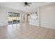 Gathering room with sliding doors to backyard and kitchen access at 22707 Eagles Watch Dr, Land O Lakes, FL 34639