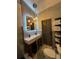 Spa-like bathroom with double vanity, walk-in shower, and barn door at 2765 Mauritania Rd, Punta Gorda, FL 33983