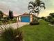 Home exterior with a vibrant blue garage door at 2765 Mauritania Rd, Punta Gorda, FL 33983