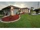 Landscaped yard with curb appeal and modern lighting at 2765 Mauritania Rd, Punta Gorda, FL 33983