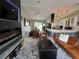 Open living space with modern fireplace and kitchen at 2765 Mauritania Rd, Punta Gorda, FL 33983