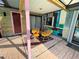 Relaxing patio area with colorful chairs and unique wall art at 2765 Mauritania Rd, Punta Gorda, FL 33983