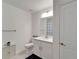 Clean bathroom with white cabinets, a shower/tub combo, and a quartz countertop at 31451 Moniker Mast Ln, San Antonio, FL 33576