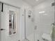 Clean bathroom with a shower stall and a built-in bench at 31451 Moniker Mast Ln, San Antonio, FL 33576