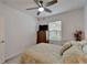 Spacious bedroom with a double bed, dresser, and ceiling fan at 31451 Moniker Mast Ln, San Antonio, FL 33576