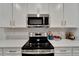 Stainless steel stove and microwave at 31451 Moniker Mast Ln, San Antonio, FL 33576