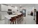 Modern kitchen with white cabinets and island at 31451 Moniker Mast Ln, San Antonio, FL 33576