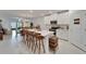 Open concept kitchen with island and bar stools at 31451 Moniker Mast Ln, San Antonio, FL 33576