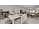 Open kitchen with island and dining area at 31451 Moniker Mast Ln, San Antonio, FL 33576
