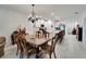 Open concept kitchen and dining area with white cabinets, island, and stainless steel appliances at 31451 Moniker Mast Ln, San Antonio, FL 33576