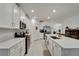 Modern kitchen with white cabinets and island at 31451 Moniker Mast Ln, San Antonio, FL 33576