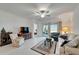 Comfortable living room with sliding doors leading to patio and view to Primary bedroom at 31451 Moniker Mast Ln, San Antonio, FL 33576
