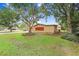 House exterior showcasing the side yard and landscaping at 3703 Perdew Dr, Land O Lakes, FL 34638