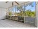 Screened balcony overlooking lush landscaping and trees at 4143 56Th N St # 1003, Kenneth City, FL 33709