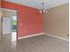 Dining room with tile floors and an accent wall at 4143 56Th N St # 1003, Kenneth City, FL 33709