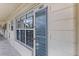 Condo entry with glass door and windows, showing building interior at 4143 56Th N St # 1003, Kenneth City, FL 33709