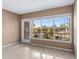 Spacious living room with large windows and view of pond at 4143 56Th N St # 1003, Kenneth City, FL 33709