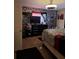 Bedroom with patterned wallpaper, ceiling fan, and carpeted floors at 4150 15Th S Ave, St Petersburg, FL 33711