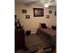 Bedroom with animal print bedding, ceiling fan, and framed artwork at 4150 15Th S Ave, St Petersburg, FL 33711