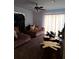 Inviting living room with large windows, ceiling fan, and unique wood coffee tables at 4150 15Th S Ave, St Petersburg, FL 33711