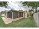 A screened-in porch and patio overlook a spacious grassy backyard at 4543 20Th N Ave, St Petersburg, FL 33713