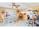 Dining room and adjacent kitchen with white cabinets, ceiling fan, and tile floor at 4543 20Th N Ave, St Petersburg, FL 33713