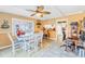 Bright dining area with white table and chairs, ceiling fan, and access to the kitchen at 4543 20Th N Ave, St Petersburg, FL 33713