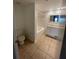 Clean bathroom with a bathtub, toilet and vanity at 504 S Armenia Ave # 1323, Tampa, FL 33609