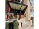 Building entrance with gated access and awning at 504 S Armenia Ave # 1323, Tampa, FL 33609