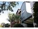 Building exterior with palm trees and unique architectural features at 504 S Armenia Ave # 1323, Tampa, FL 33609