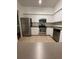 Modern kitchen with stainless steel appliances and white cabinets at 504 S Armenia Ave # 1323, Tampa, FL 33609