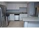 Kitchen features stainless steel appliances and white cabinets at 504 S Armenia Ave # 1323, Tampa, FL 33609