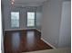 Living room with hardwood floors and neutral walls at 504 S Armenia Ave # 1323, Tampa, FL 33609