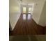 Bright living room featuring hardwood floors and large windows at 504 S Armenia Ave # 1323, Tampa, FL 33609